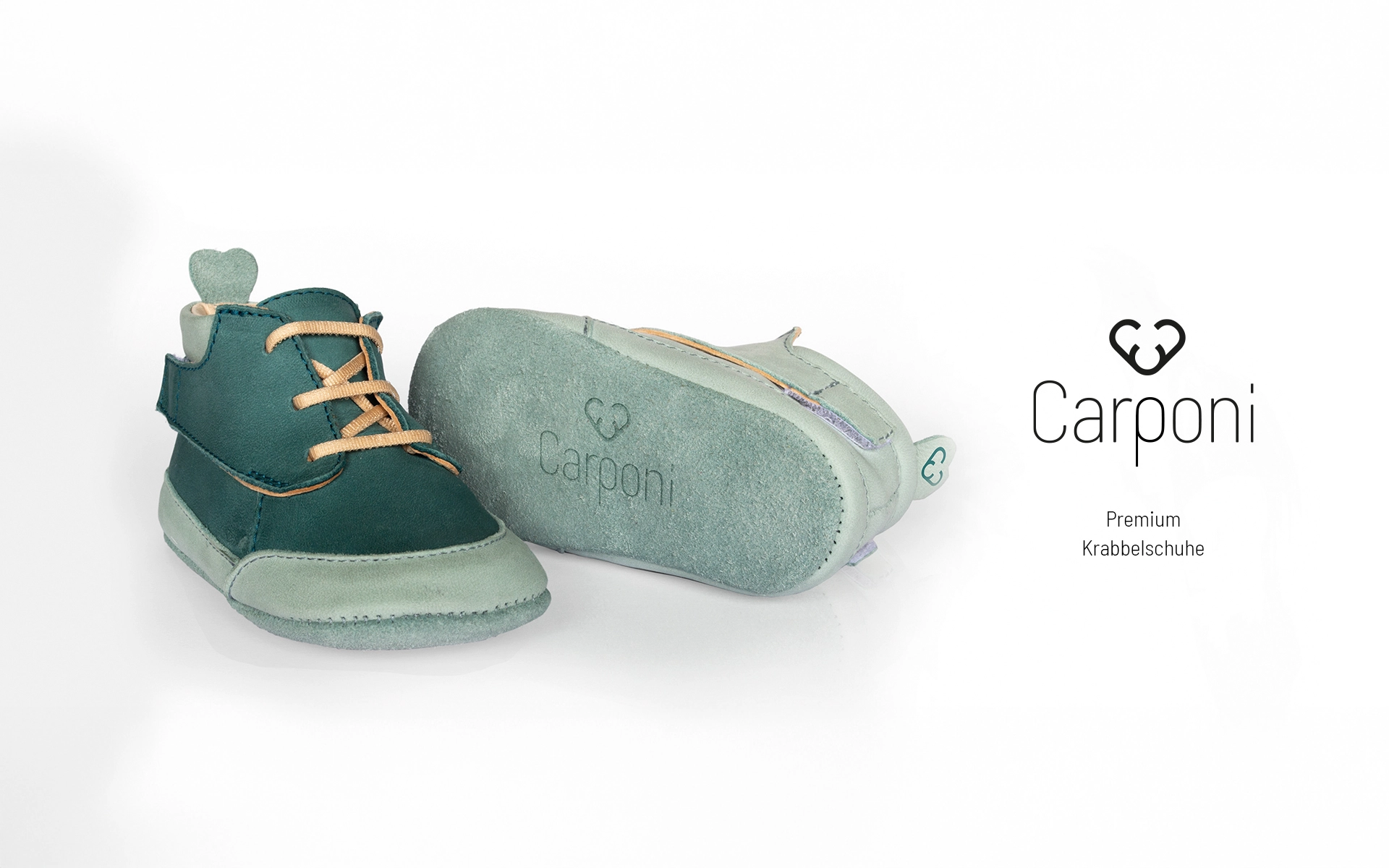 View of the Carponi logo in combination with branded crawling shoes - as an example of consistent brand application in product design.