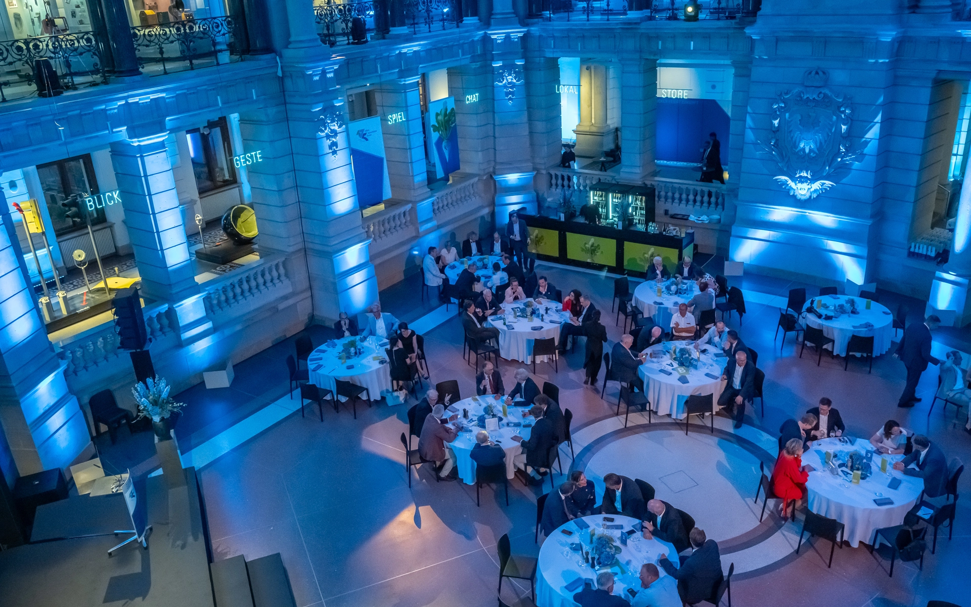 View of the anniversary event in the room from above with the branding in the room for the Economic Association of Sugar e. V.